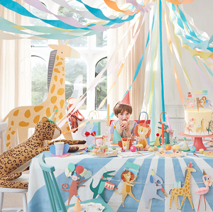 Colorful animal-themed party setup with decorations and whimsical toys, perfect for children's birthdays.
