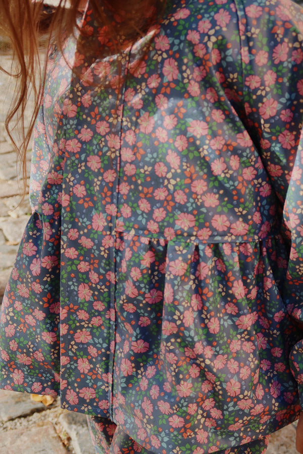 Palme Rüschen-Regenset Kyoto in buntem Blumenmuster, ideal für Kinder an regnerischen Tagen.