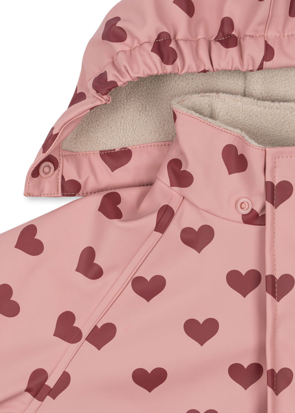 Palme Rüschen-Regenset in Pink mit Herzdesign und Fleecefutter, ideal für Kinder bei Regenwetter.
